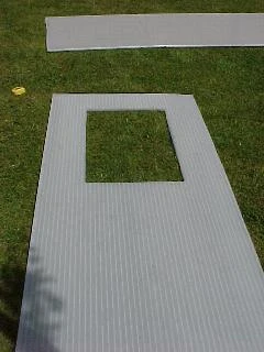 Hole Cut For A Polycarbonate Vent Polycarbonate sheet with a hole ready for a roof vent window