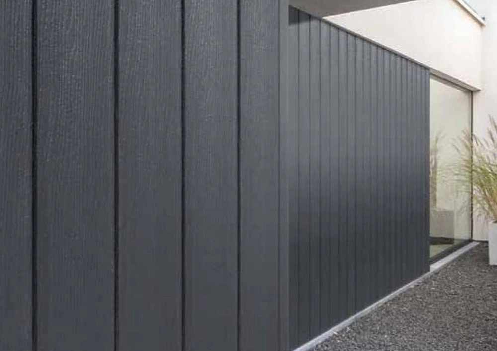 Anthracite grey vertical wall cladding UPVC 167mm boards showing modern building exterior
